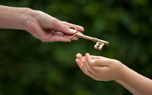 Mother Handing Key To Daughter